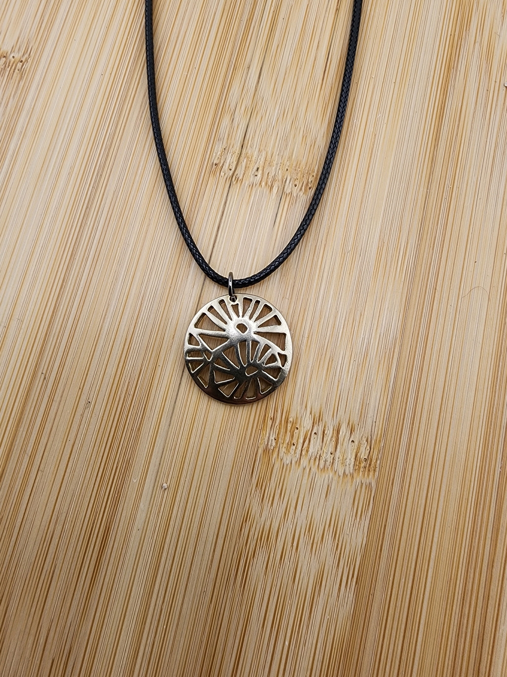 18in Adjustable Gold Tone Sunburst Pendant Necklace on Black Cord -